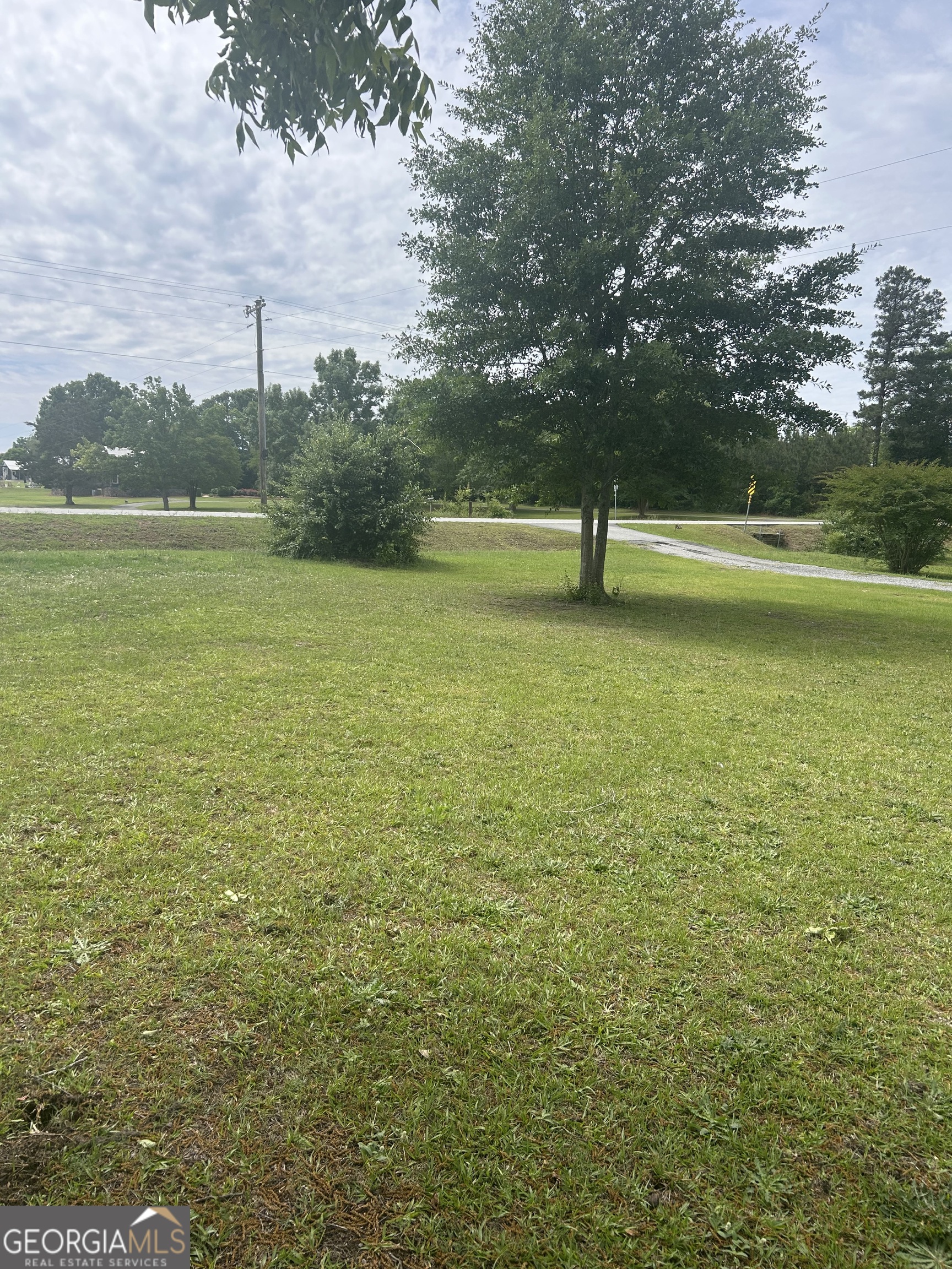 1277 Highway 112 Cochran, GA 31014 - Photo 8 of 10 a view of a lake with a yard