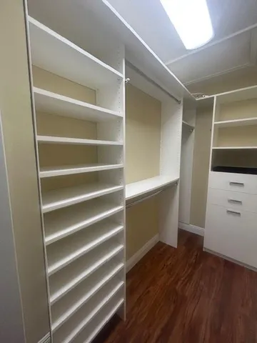 a bathroom with a toilet and shower