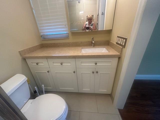 2821 Southeast 5th Circle Boynton Beach, FL 33435 - Photo 21 of 38 a bathroom with a sink a toilet and vanity