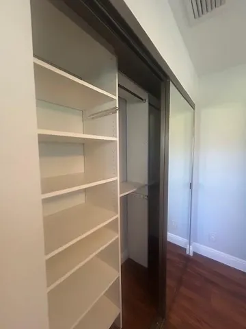 a white bath tub sitting next to a toilet