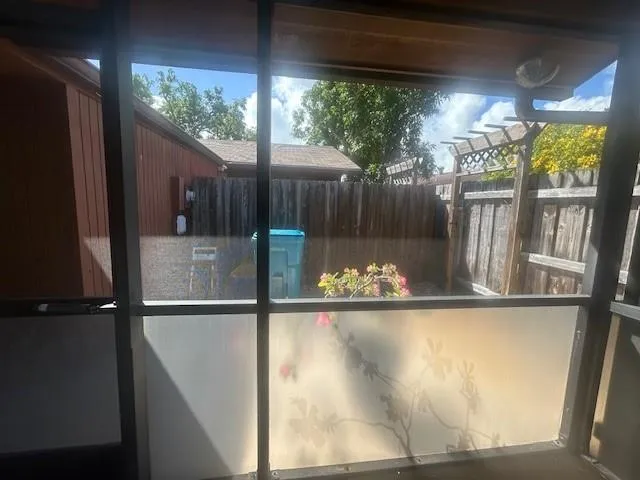 a view of a backyard with furniture and a grill