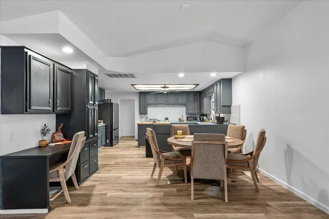 a bedroom with furniture and a large window