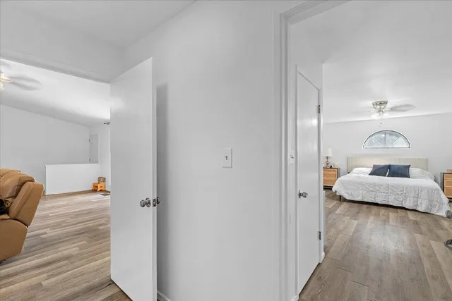 a kitchen with stainless steel appliances granite countertop a stove a sink dishwasher a microwave oven with cabinets and wooden floor