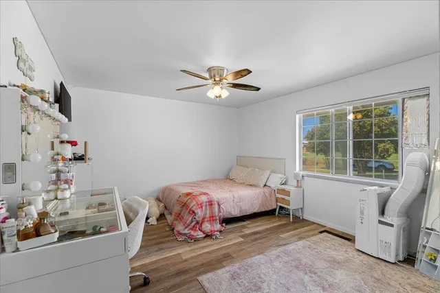 a bathroom with a sink mirror and toilet