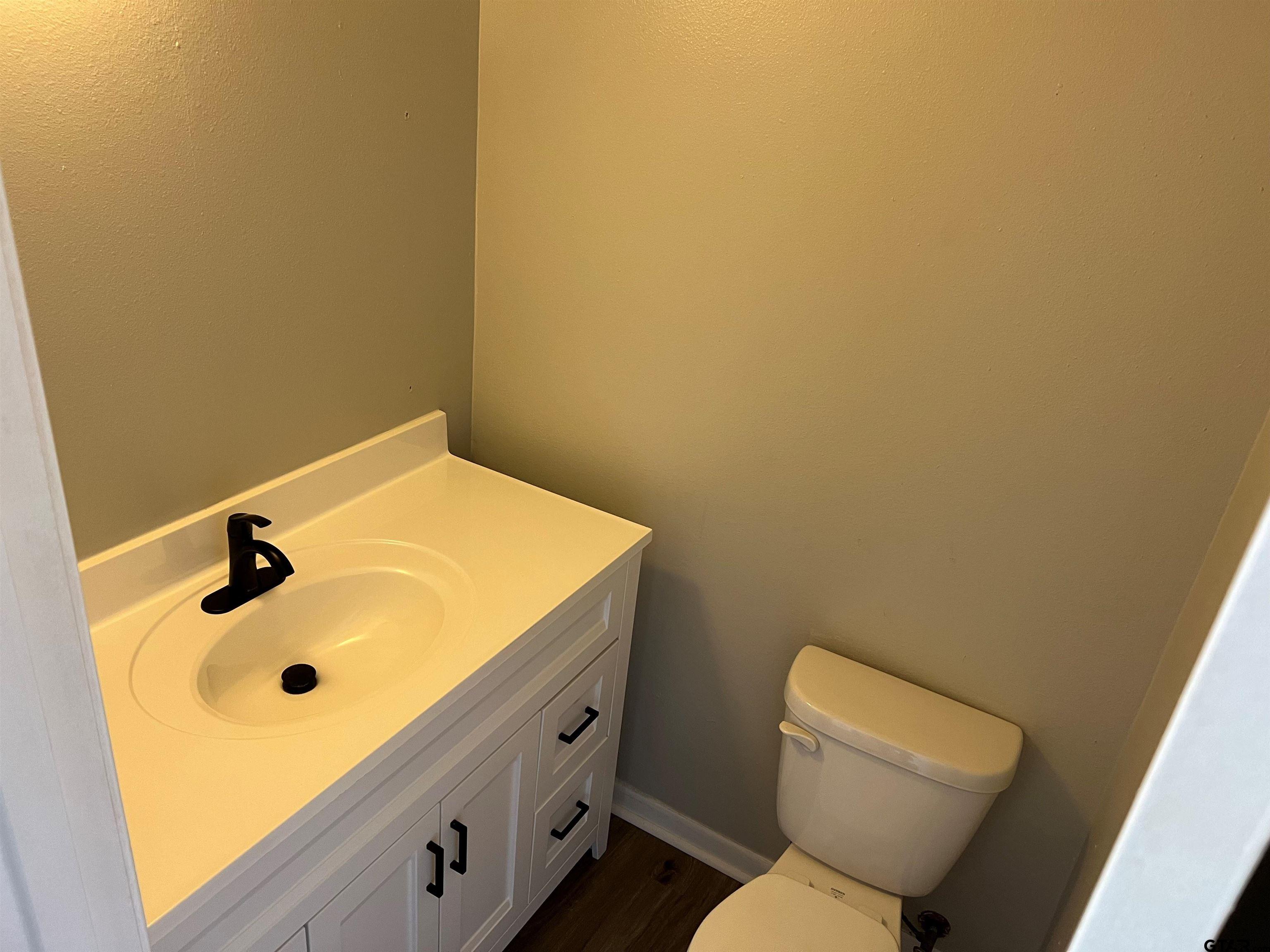 3161 Glenda Avenue, Unit 202 Tyler, TX 75704 - Photo 12 of 13 a bathroom with a sink and a toilet