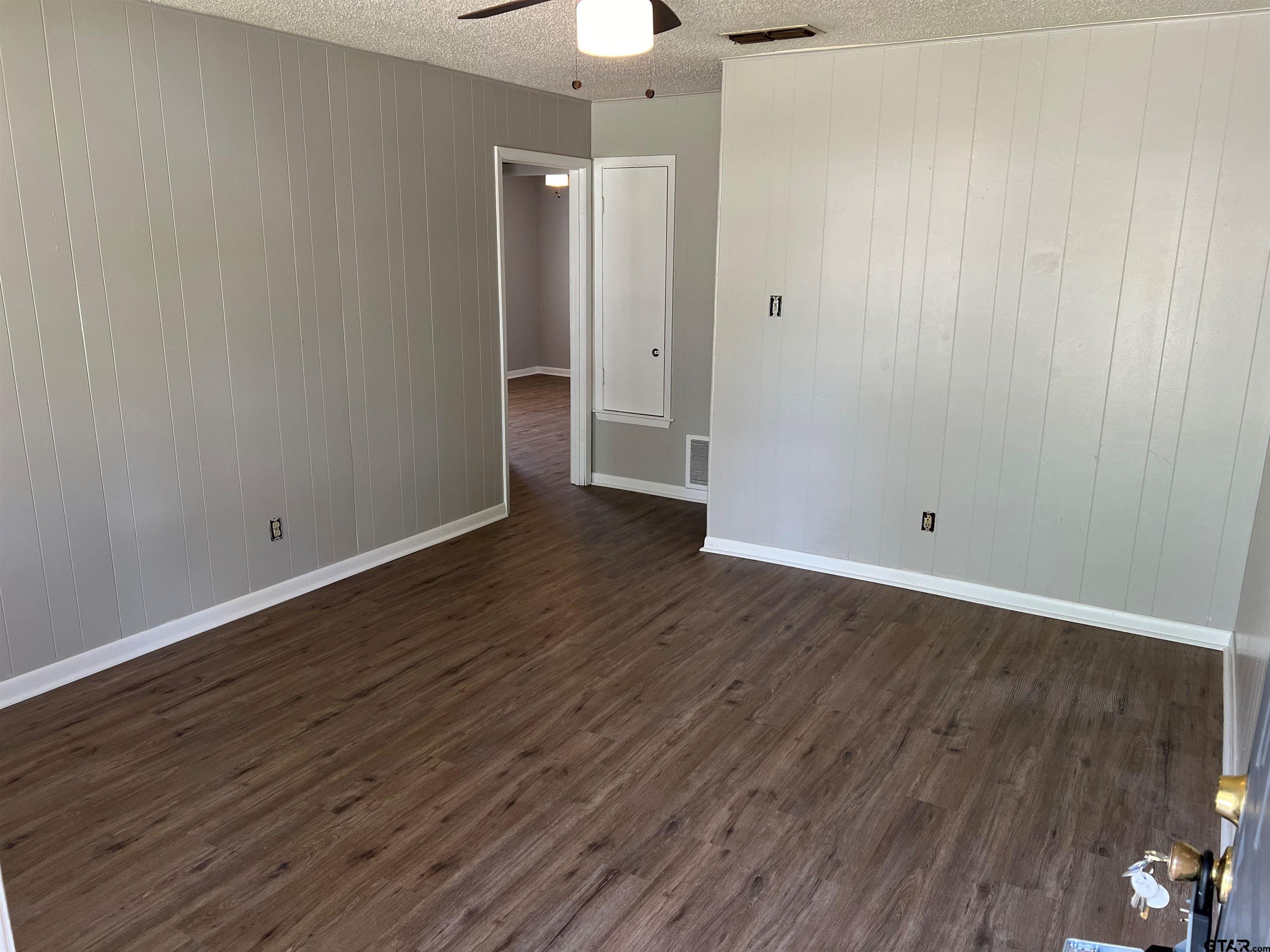 3161 Glenda Avenue, Unit 202 Tyler, TX 75704 - Photo 3 of 13 wooden floor in an empty room
