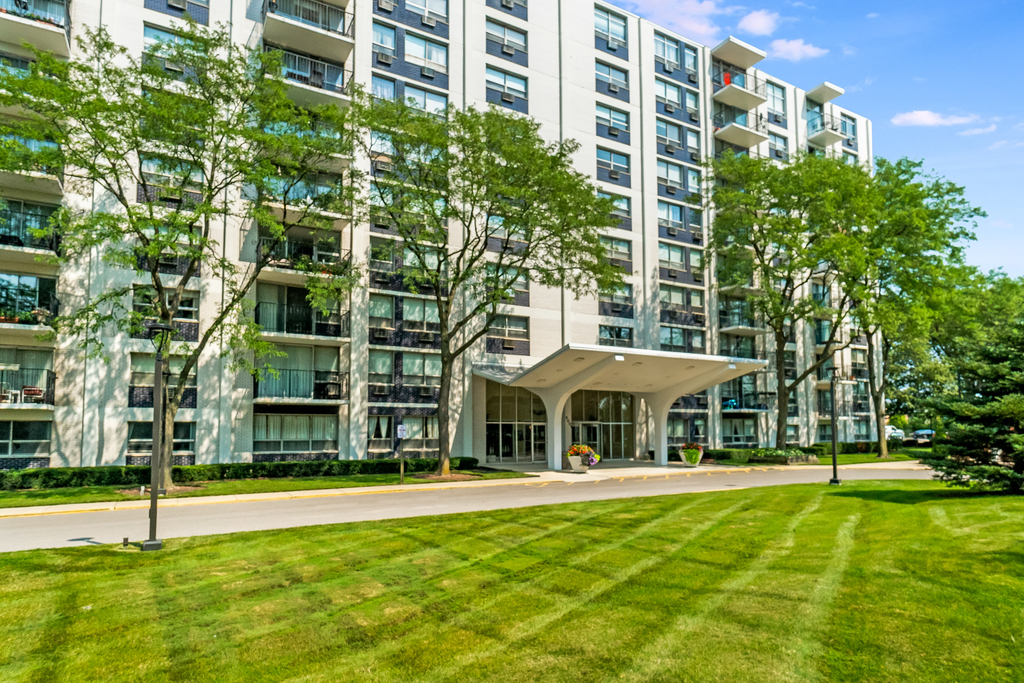 9001 Golf Road, Unit 4D Des Plaines, IL 60016 - Photo 1 of 15 a swimming pool with outdoor seating and yard