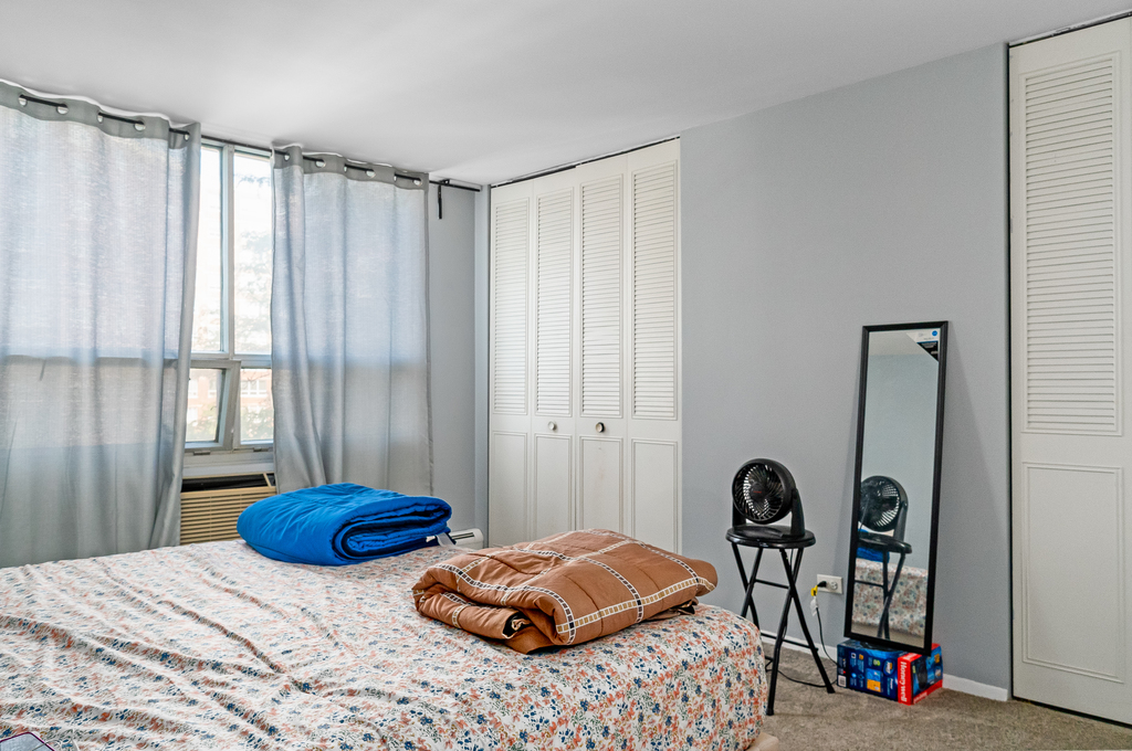 9001 Golf Road, Unit 4D Des Plaines, IL 60016 - Photo 11 of 15 a bedroom with a bed and a window