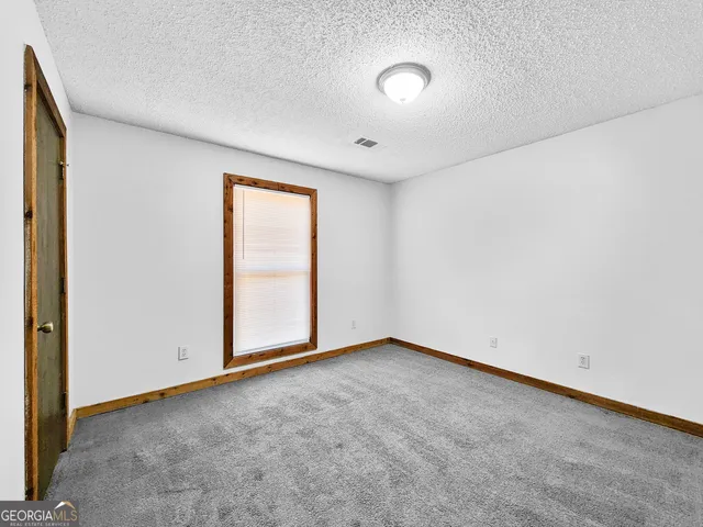 an empty room with window