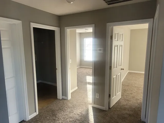 a view of a bathroom with a glass door and a sink