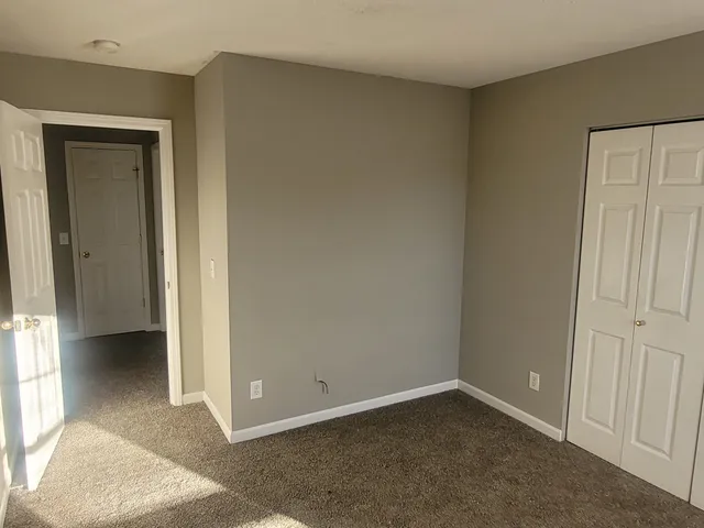 an empty room and closet area