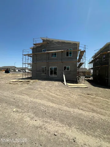 a view of a house with a snow in the yard