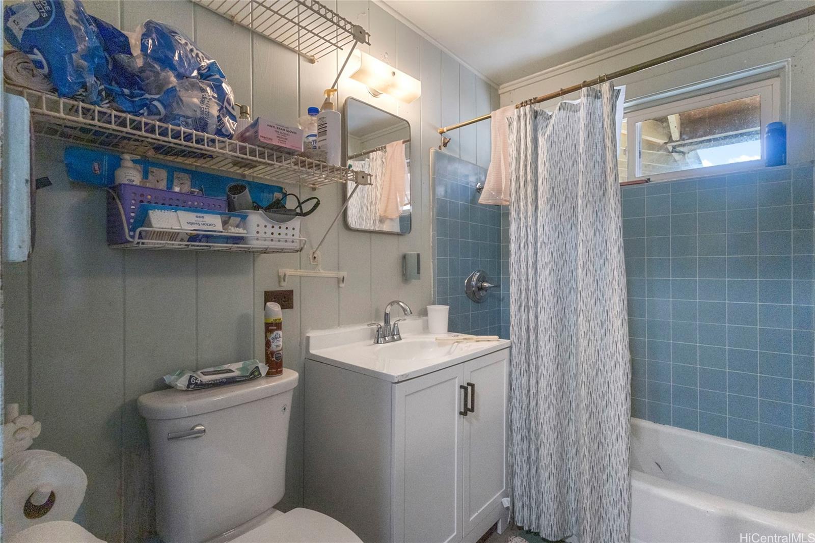 1238 Molehu Drive Honolulu, HI 96818 - Photo 14 of 25 a bathroom with a sink a toilet and shower