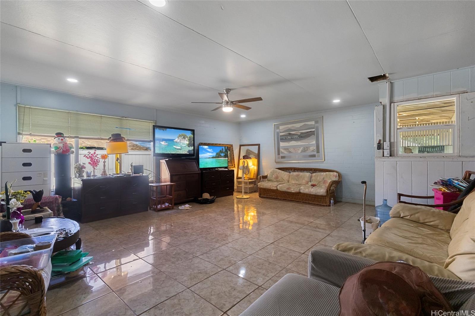 1238 Molehu Drive Honolulu, HI 96818 - Photo 20 of 25 a living room with furniture and a flat screen tv