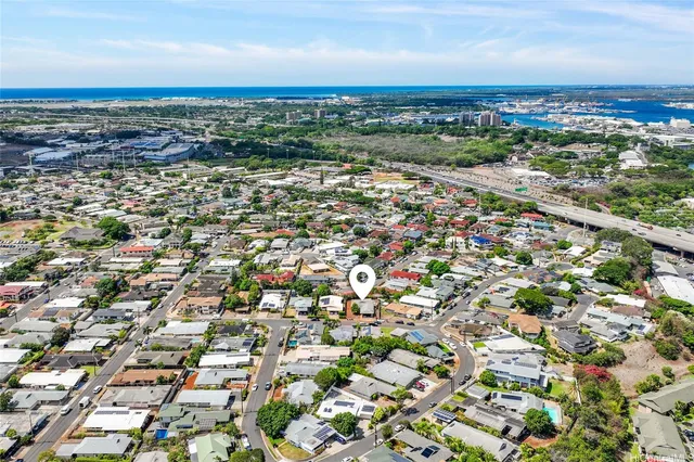 an aerial view of residential house and green space