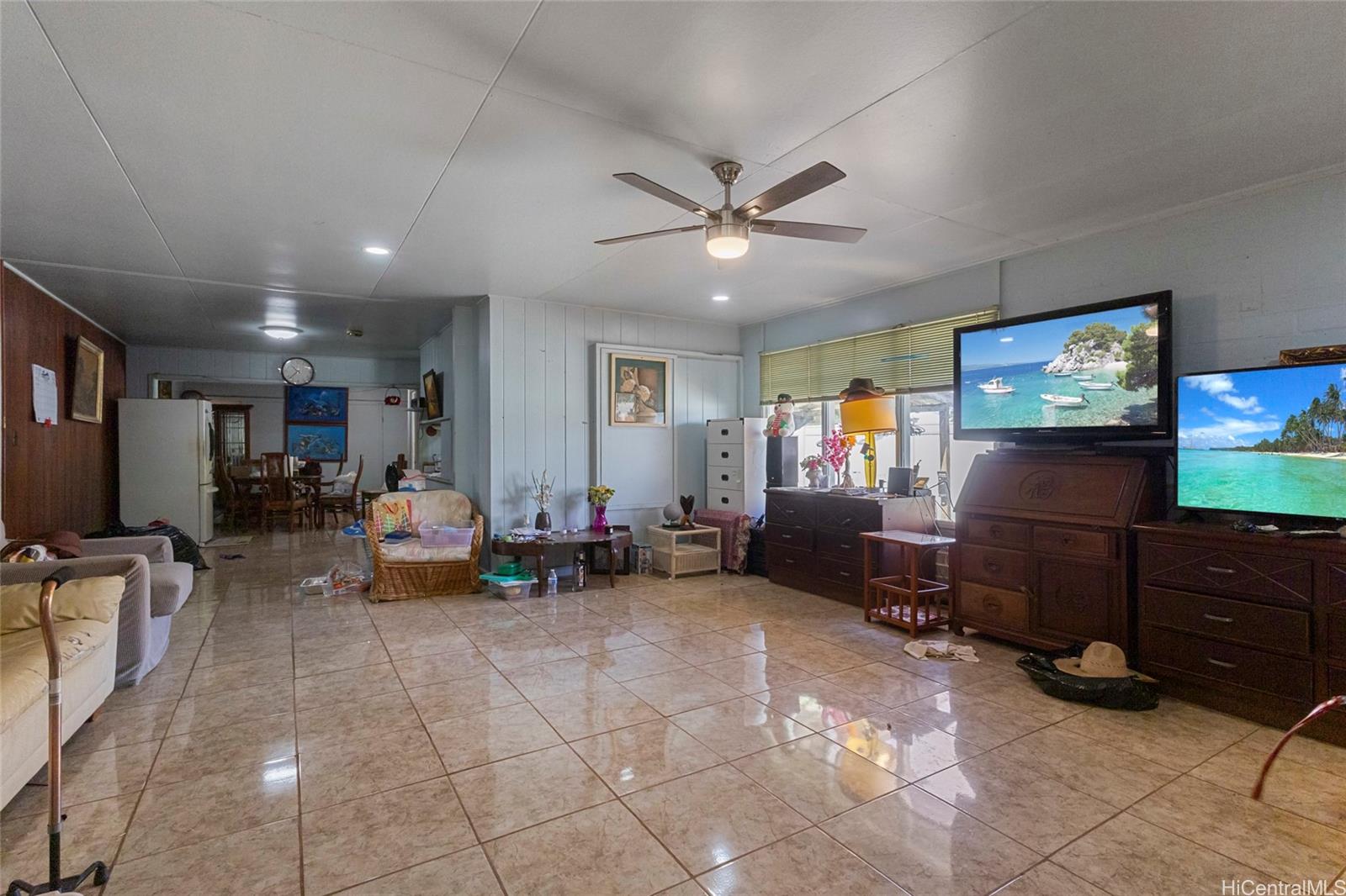 1238 Molehu Drive Honolulu, HI 96818 - Photo 6 of 25 a living room with furniture and a flat screen tv