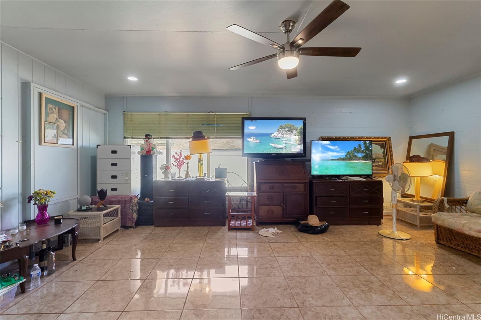 1238 Molehu Drive Honolulu, HI 96818 - Photo 7 of 25 a living room with furniture and a flat screen tv