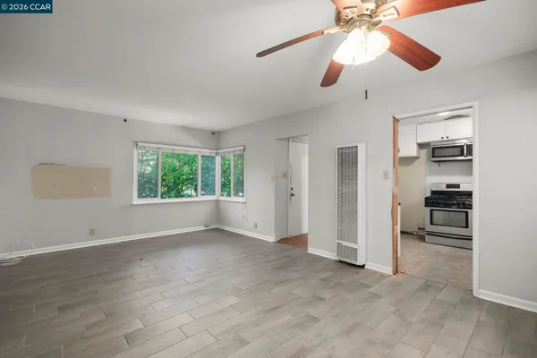 a kitchen with stainless steel appliances a stove a sink and a refrigerator