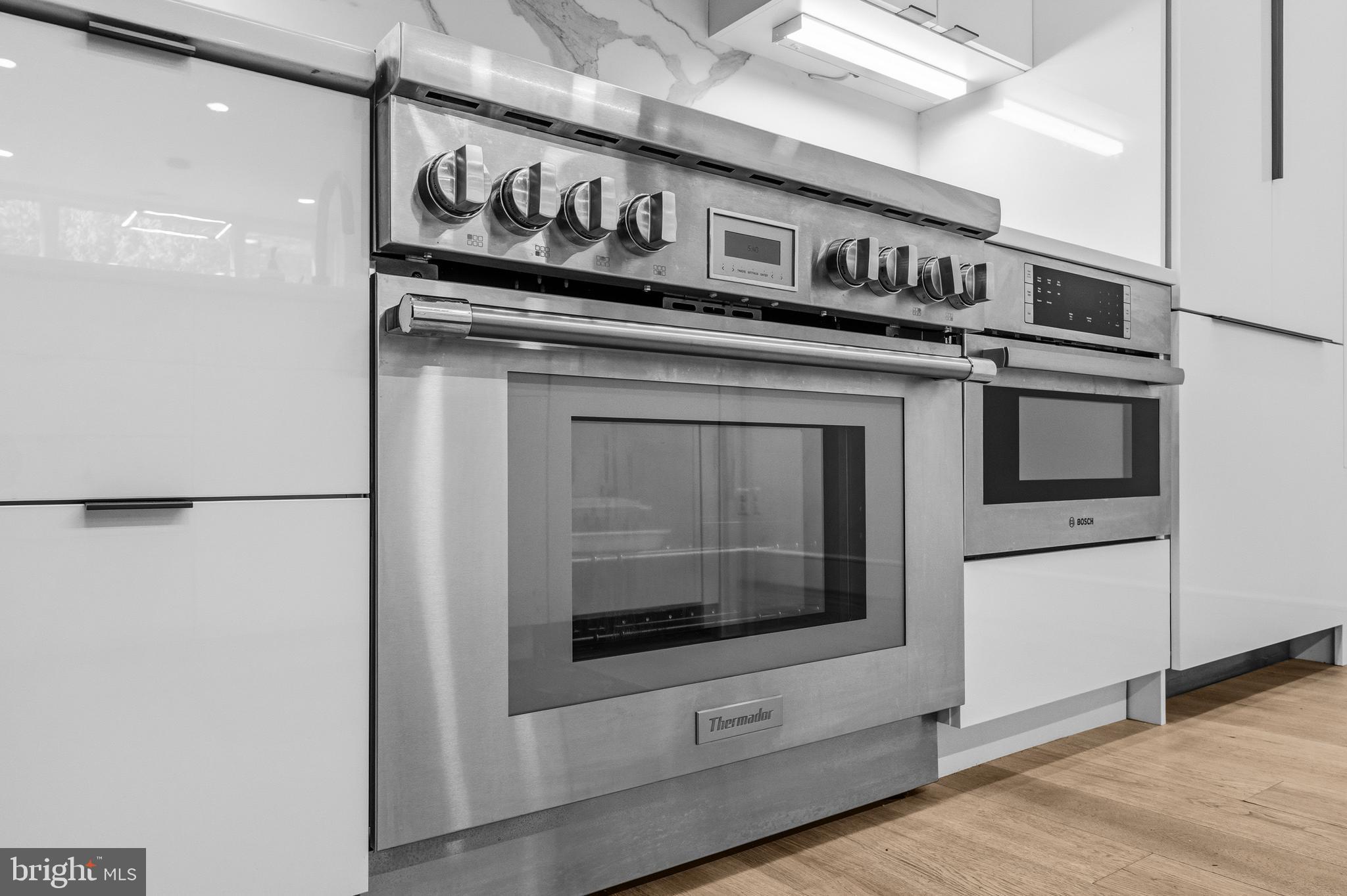 1729 T Street Northwest, Unit 3 Washington, DC 20009 - Photo 13 of 38 a close view of a stove top oven sitting inside of a kitchen