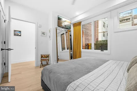 a bedroom with a bed and a walk in closet