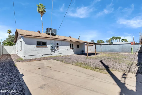 a house view with a backyard space