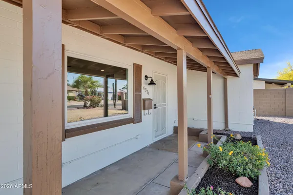 a kitchen with a sink stove and microwave