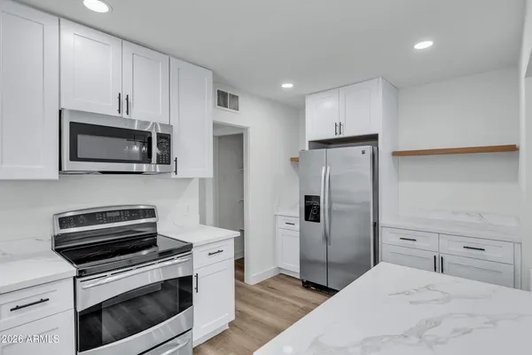 a kitchen with a sink and cabinets