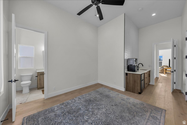 404 North Marsala Way St. George, UT 84770 - Photo 12 of 26 Bar with ceiling fan, light wood finished floors, recessed lighting, and fridge