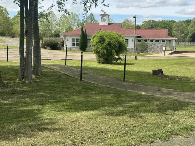 a view of a roof deck with a table and chairs under an umbrella