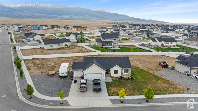 464 South Trejo Rdg Road Grantsville, UT 84029 - Photo 29 of 33 Aerial view of residential area featuring a mountainous background