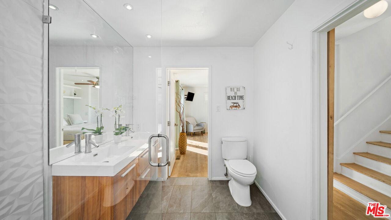 21344 Rambla Vista Malibu, CA 90265 - Photo 13 of 32 a bathroom with a sink toilet and shower