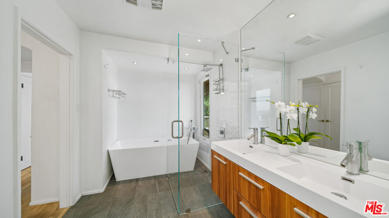 21344 Rambla Vista Malibu, CA 90265 - Photo 14 of 32 a bathroom with a double vanity sink mirror double and bathtub