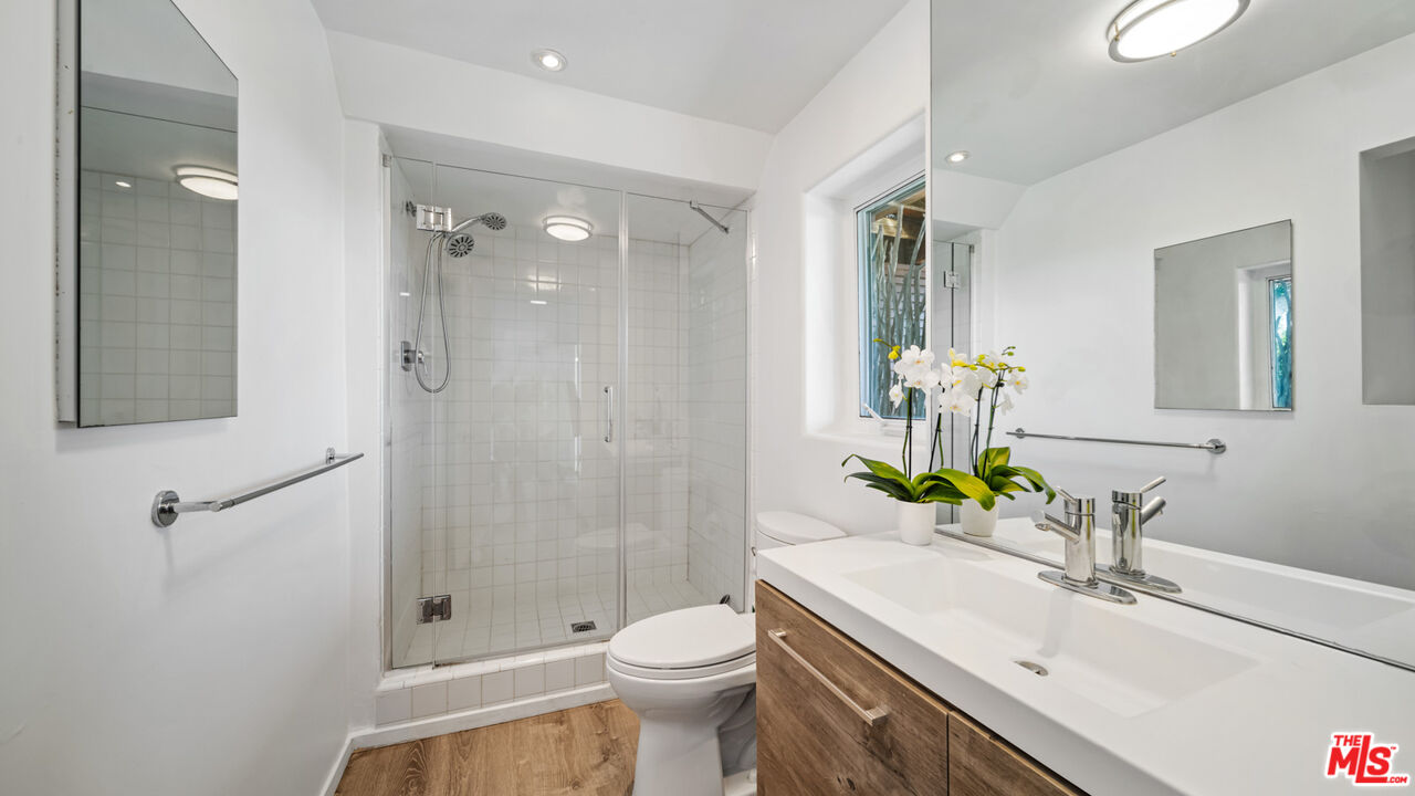 21344 Rambla Vista Malibu, CA 90265 - Photo 18 of 32 a bathroom with a sink toilet and shower