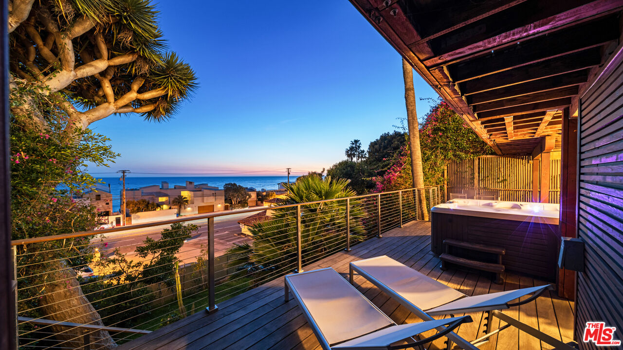 21344 Rambla Vista Malibu, CA 90265 - Photo 24 of 32 a view of roof deck with wooden floor and outdoor seating