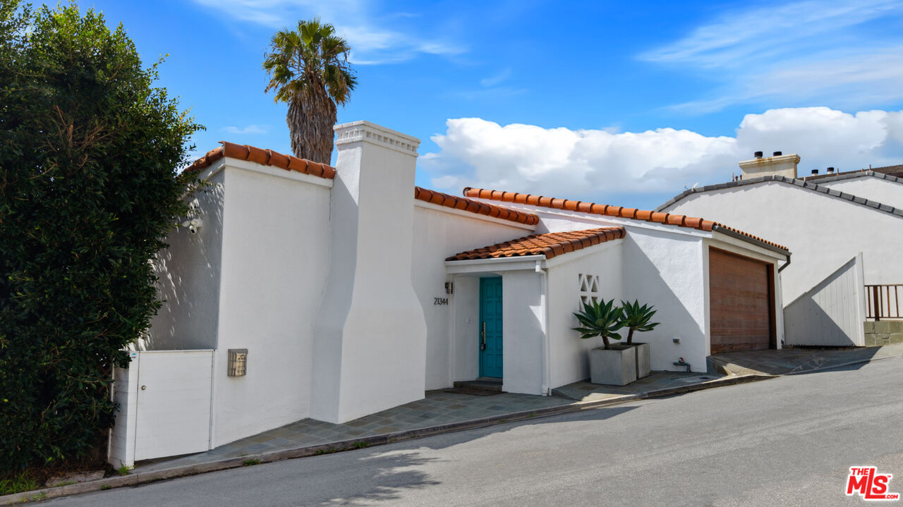 21344 Rambla Vista Malibu, CA 90265 - Photo 27 of 32 a front view of a house with plants
