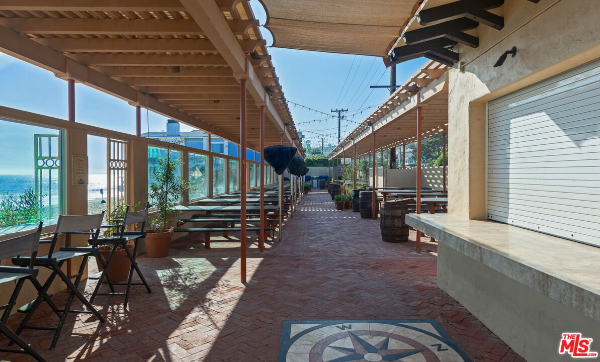 21344 Rambla Vista Malibu, CA 90265 - Photo 32 of 32 a view of a chairs and table in the balcony