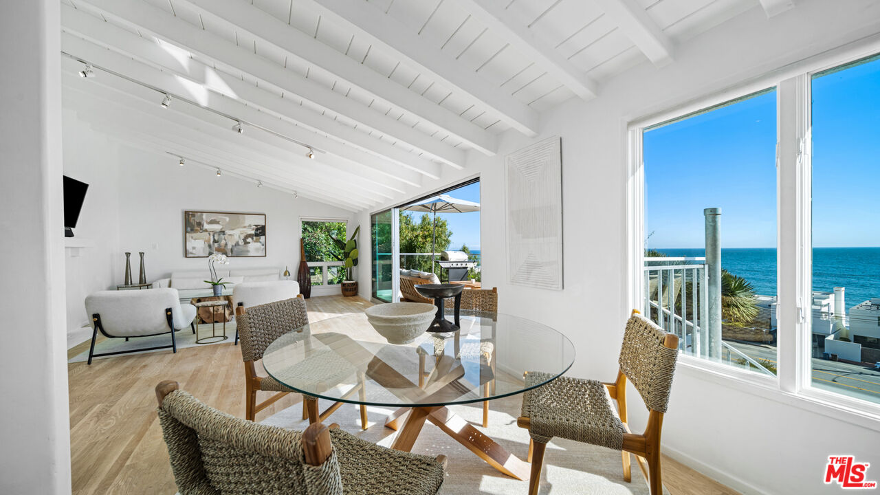 21344 Rambla Vista Malibu, CA 90265 - Photo 9 of 32 a view of a dining room with furniture window and outside view