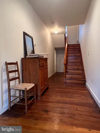 a view of livingroom with hardwood floor and a ceiling fan