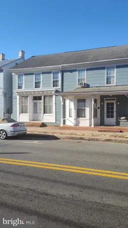 a view of a brick house with a patio