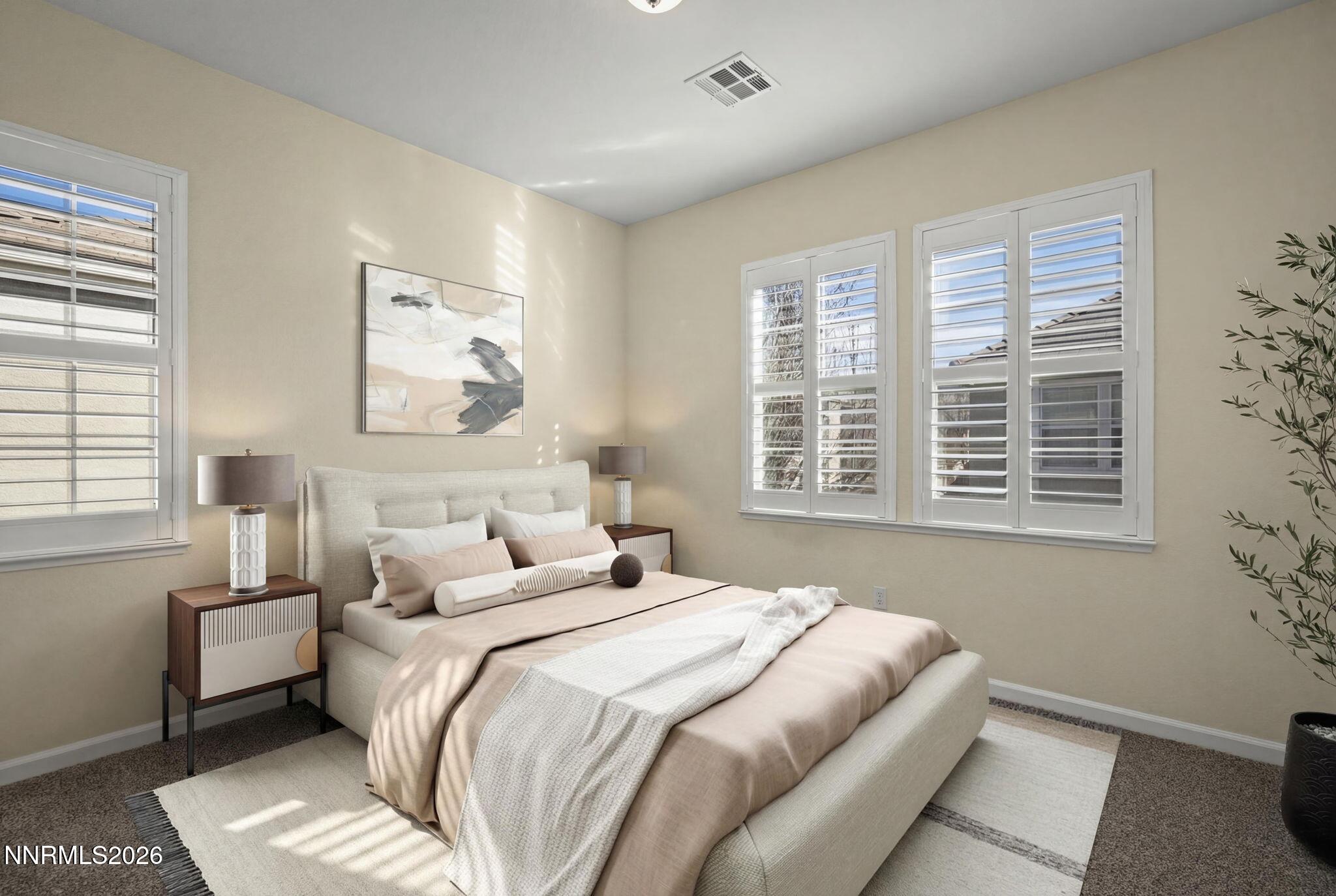 6953 Sacred Circle Sparks, NV 89436 - Photo 12 of 26 a bedroom with bed and a window
