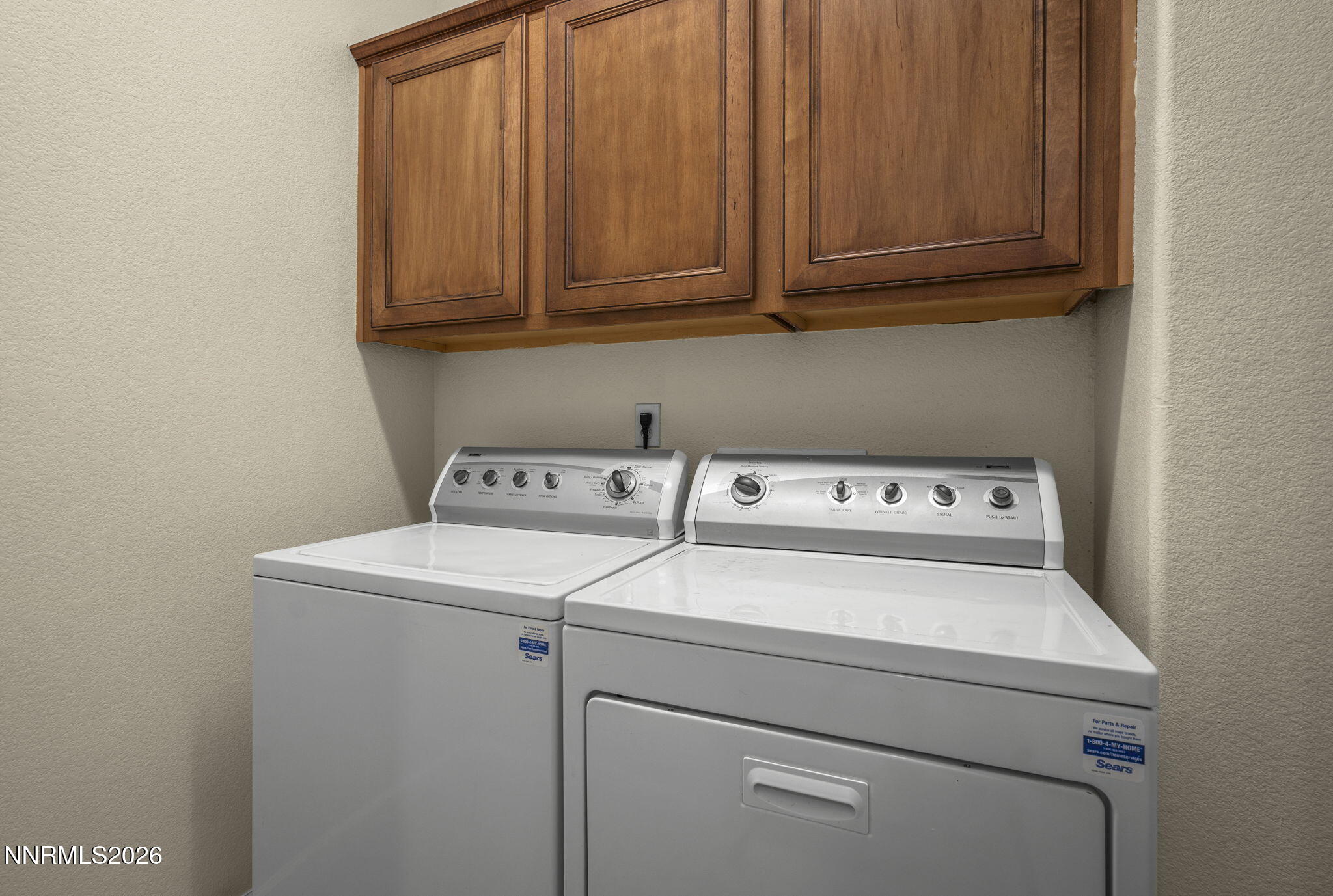 6953 Sacred Circle Sparks, NV 89436 - Photo 14 of 26 a utility room with dryer and washer
