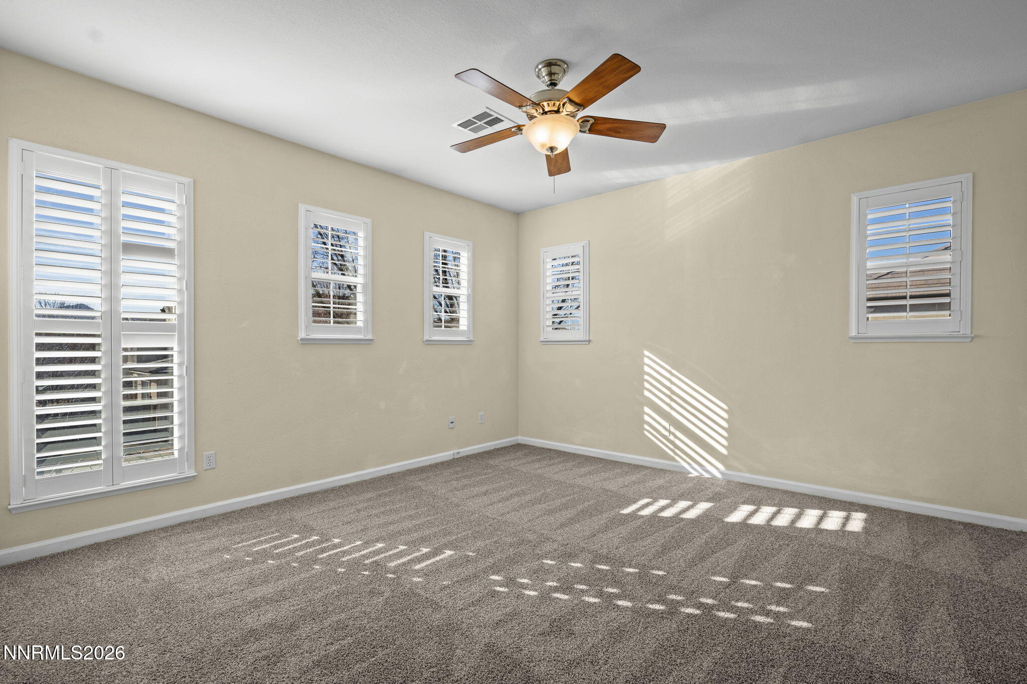 6953 Sacred Circle Sparks, NV 89436 - Photo 20 of 26 a view of an empty room with a window