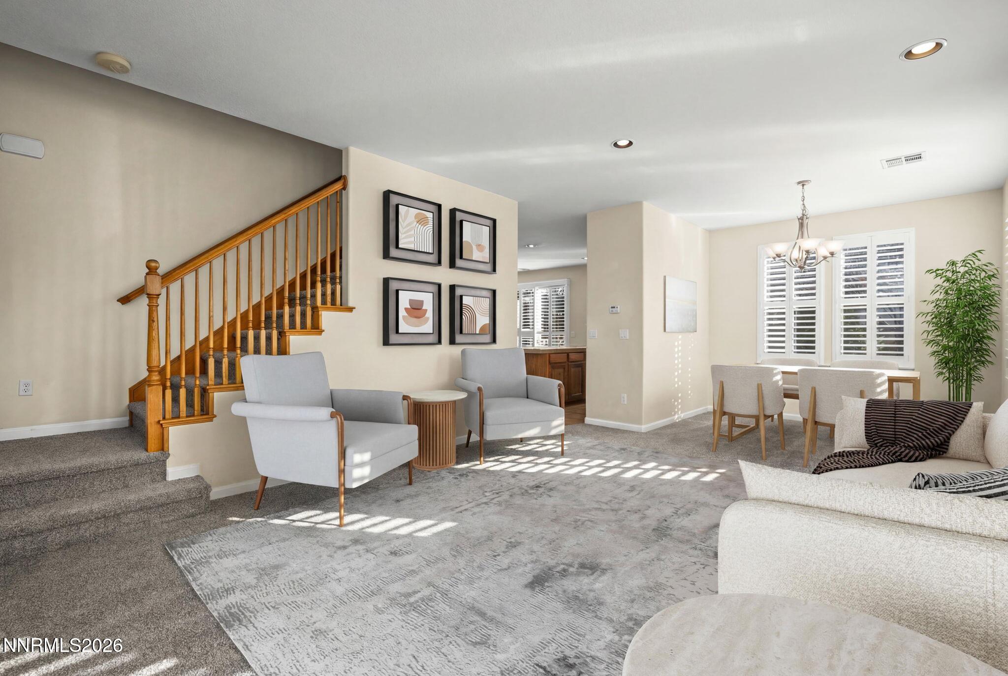 6953 Sacred Circle Sparks, NV 89436 - Photo 2 of 26 a living room with furniture and large windows