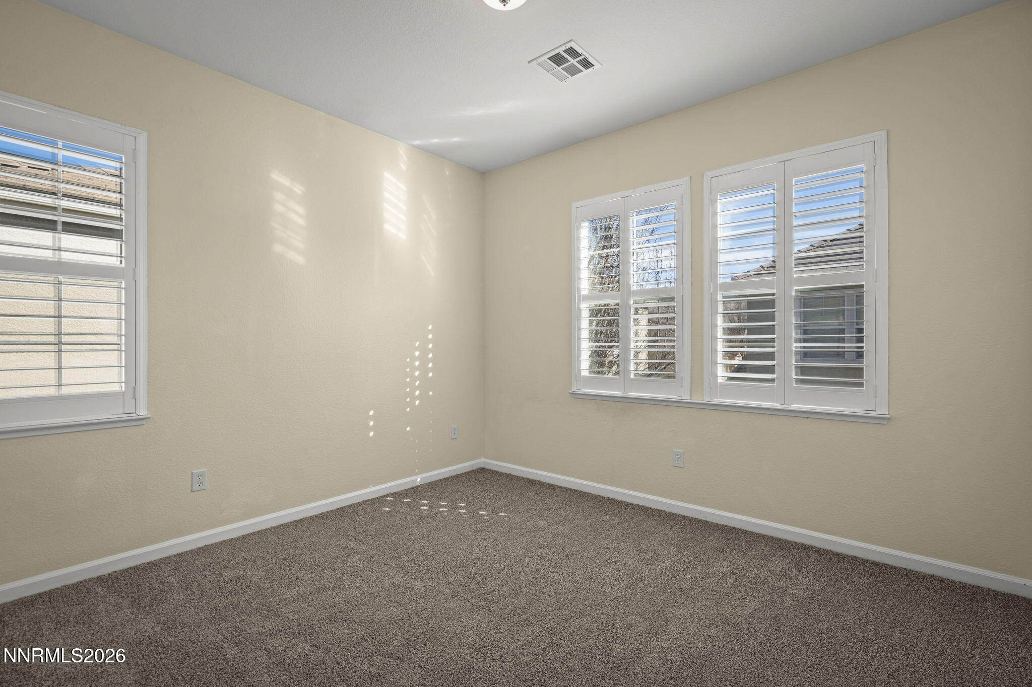 6953 Sacred Circle Sparks, NV 89436 - Photo 22 of 26 an empty room with a window