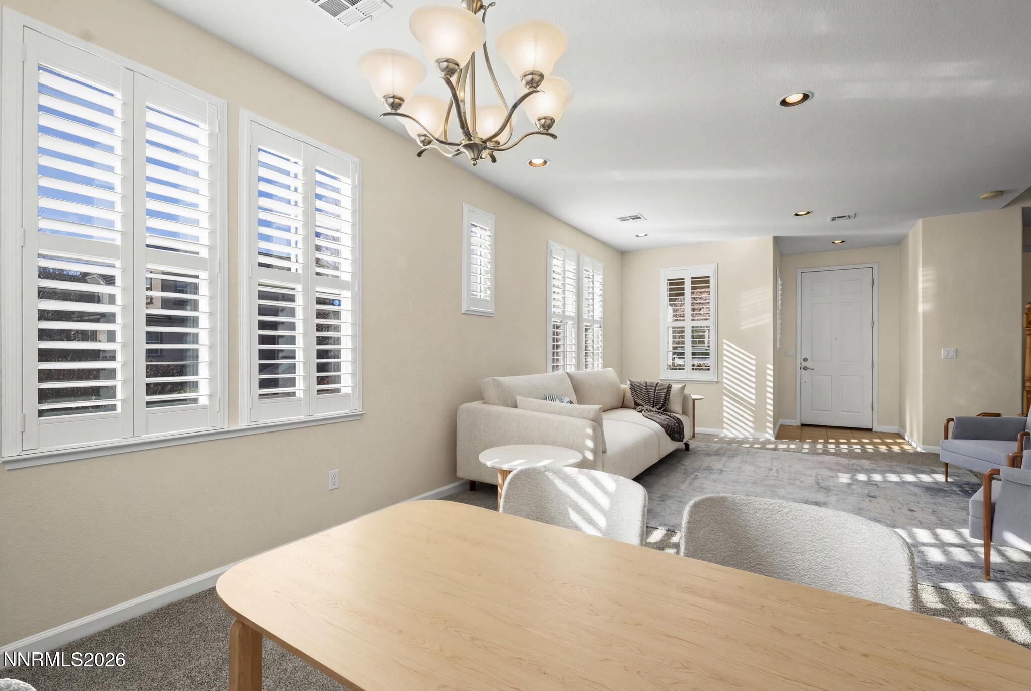 6953 Sacred Circle Sparks, NV 89436 - Photo 3 of 26 a living room with furniture and a large window