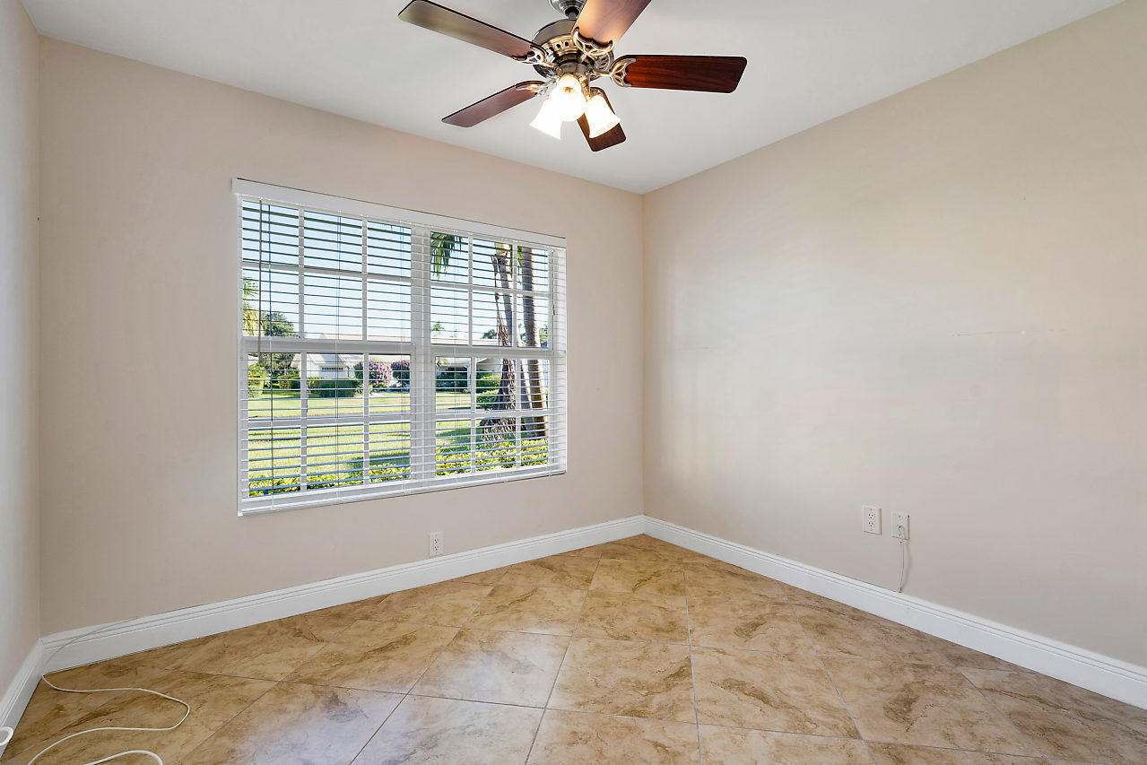 4572 White Cedar Lane Delray Beach, FL 33445 - Photo 29 of 37 a view of an empty room and chandelier fan