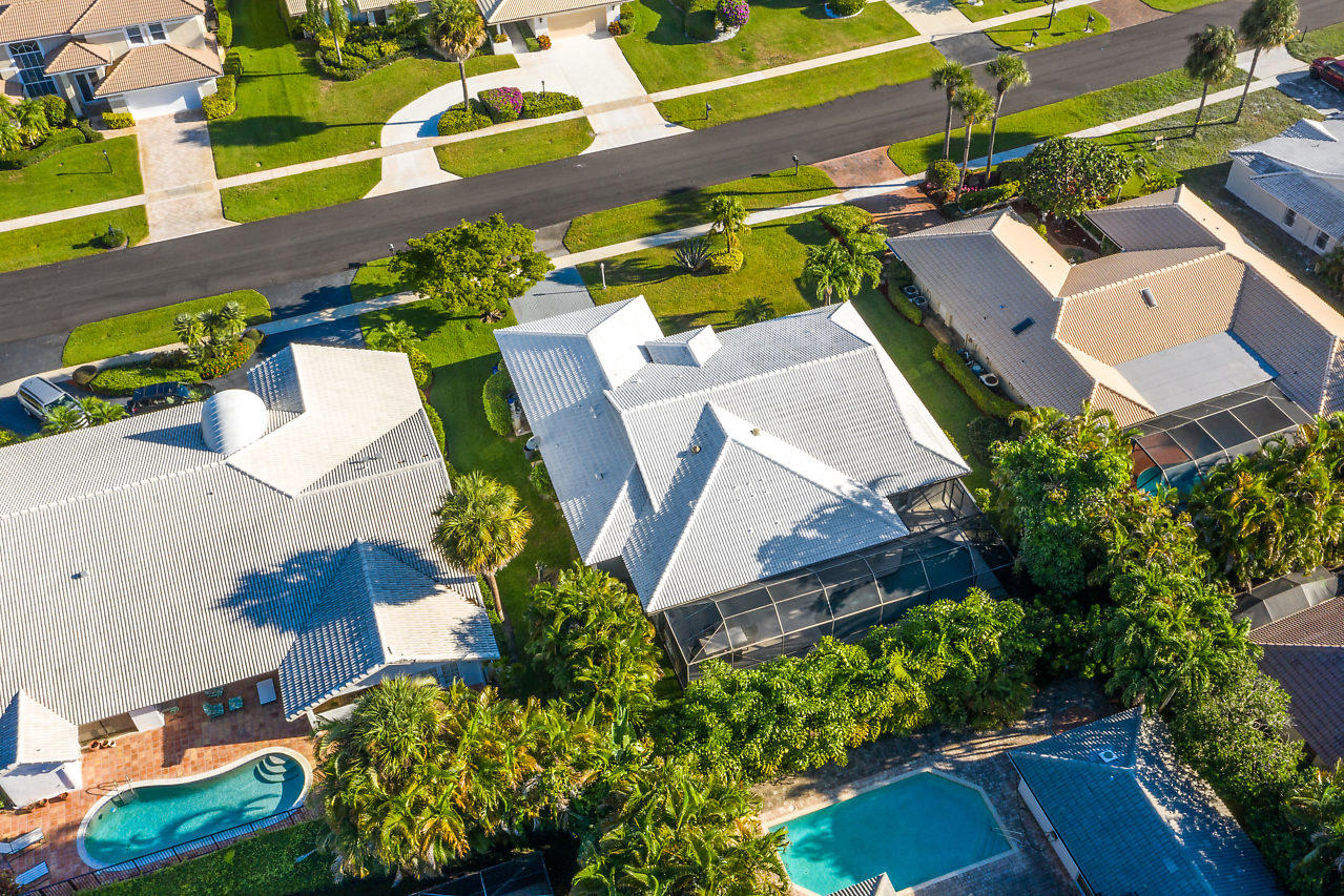 4572 White Cedar Lane Delray Beach, FL 33445 - Photo 33 of 37 an aerial view of a house with a yard and garden