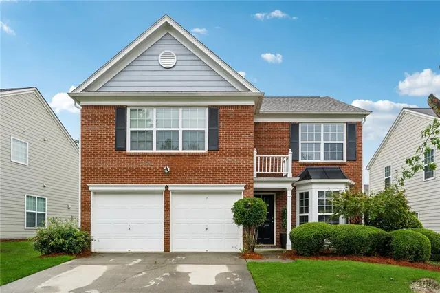 front view of a house with a yard