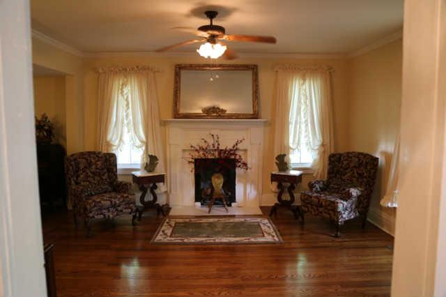 25 Sykes Road Hickman, TN 38567 - Photo 4 of 20 Living room, one of 2 sitting areas, has original hardwood floors and gas logs.
