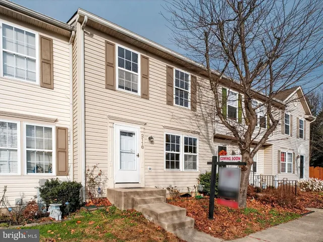 a front view of a house with outdoor seating
